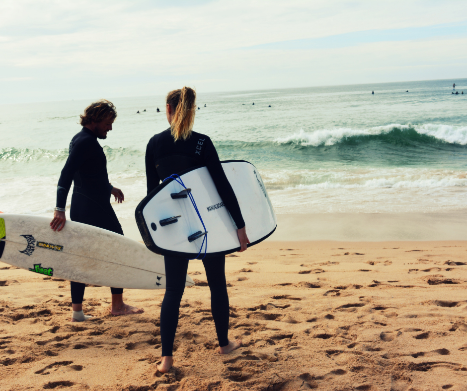 Two people going surfing 